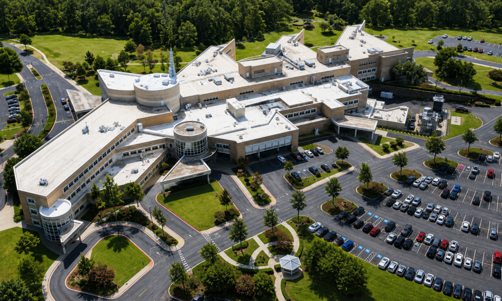 Large healthcare facility with extensive commercial low-slope roofing in Arkansas