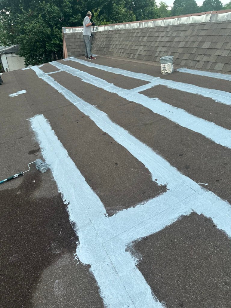 Commercial roof seams and vulnerable areas being reinforced during the roof restoration process