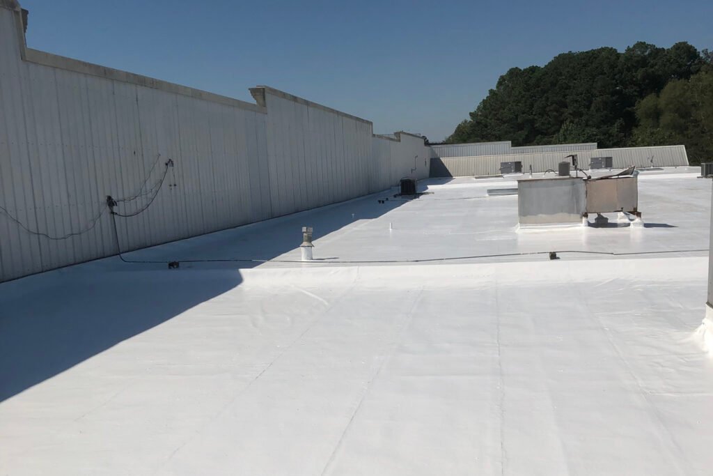 Commercial roof coating system in Arkansas restoring and protecting an existing low-slope roof